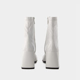 Heritage Vinyl Ankle Boots - Courreges - Leather - Dirty White