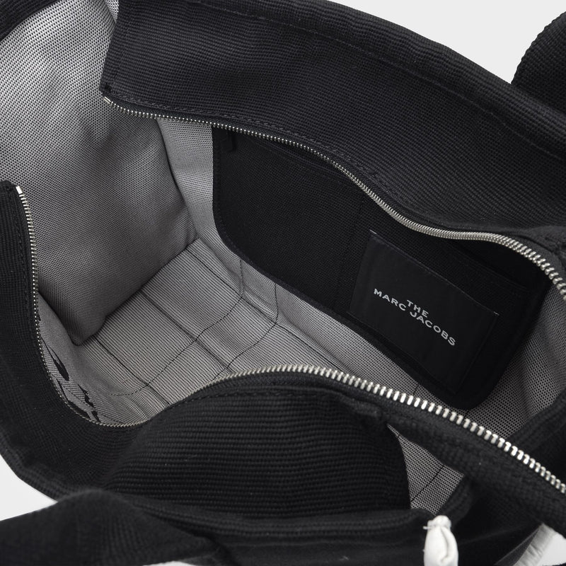 トートバッグ The Large Tote Bag in Black Canvas Marc Jacobs The Large Tote Bag in Black | Lyst